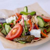 Greek Salad · Hummus, dolmas, red onions, mixed greens, cucumber, artichoke hearts, garbanzo beans, feta c...