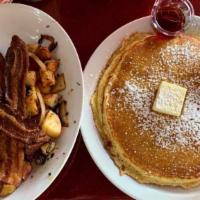 Big Guys Breakfast · Two pancakes, two eggs, bacon sausage, and home fries.