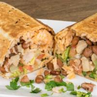 Burrito · Includes Mexican rice, your choice of beans, lettuce, cabbage, onion, tomato, cilantro, shre...
