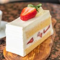 Strawberry Shortcake · Vanilla sponge cake with fresh strawberries and whipped cream filling with frosting.