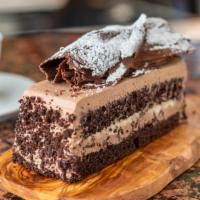 Fedora Slice · Chocolate devil's soaked with rum and filled with Italian pastry cream and fresh whipped cre...