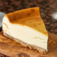 Plain Cheesecake · Graham crust and rich New York cheesecake .