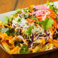 Nori Fries · Crispy French fries tossed in our house-made teriyaki sauce, sprinkled with Nori. Served wit...