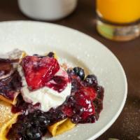 Berry Good Crepes · Thin style pancakes filled with cream cheese and topped with berry compote (fresh berries in...