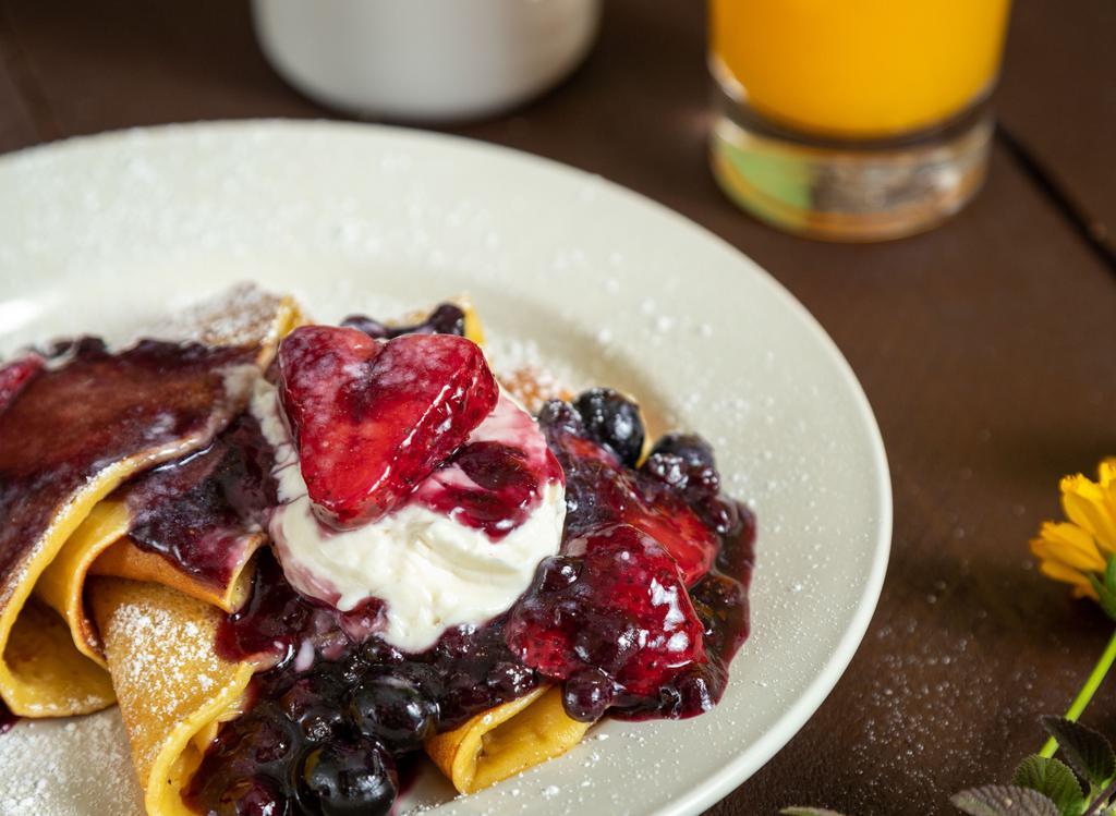 Berry Good Crepes · Thin style pancakes filled with cream cheese and topped with berry compote (fresh berries in season).