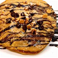 Reese's Chocolate Pancakes · Topped with Ghirardelli chocolate, powdered sugar and Reese's peanut butter.