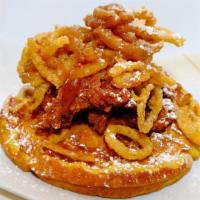 Chicken n Waffle · Crisp waffle topped with lightly battered and fried chicken breast, onion strings, and drizz...