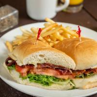BLT · Mounds of bacon, lettuce and tomatoes with mayo on a sweet roll. Served with fries.