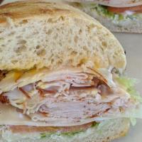 2. Spicy Turkey Sandwich · Spicy turkey on freshly baked sourdough. Includes lettuce, tomato, red onions, swiss cheese,...