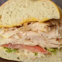 1. Oven Roasted Turkey Sandwich · Oven roasted turkey on freshly baked sourdough. Includes lettuce, tomato, red onions, swiss ...