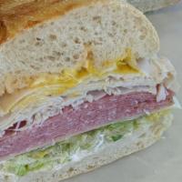 11. The Royal Sandwich · Turkey and pastrami on freshly baked sourdough. Includes lettuce, tomato, red onions, swiss ...