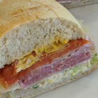 13. The Italian Sandwich · Italian salami, pepperoni and ham on freshly baked sourdough. Includes lettuce, tomato, red ...