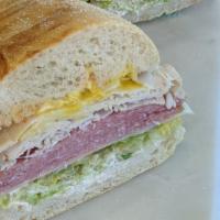 12. The Premier Sandwich · Turkey and salami on freshly baked sourdough. Includes lettuce, tomato, red onions, swiss ch...