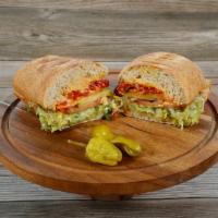 The Irresistible Vegan (Vegan) · House-made hummus, avocado, roasted peppers, cucumber, carrots on freshly baked sourdough. I...