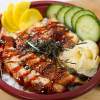 Unagi Don  · Eel, Japanese pickle radish, and seaweed salad over steam white rice, topped with roast sesa...