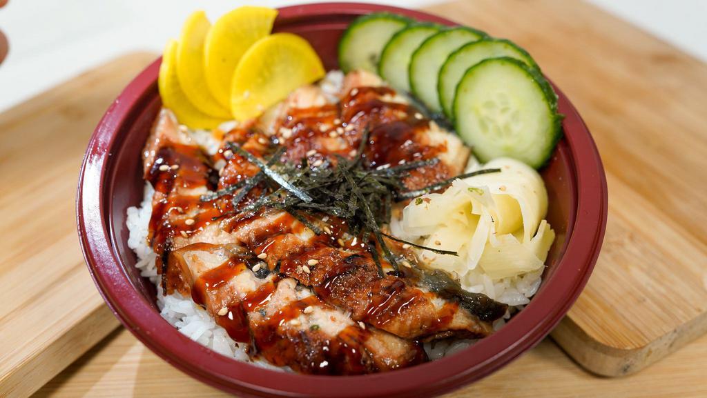 Unagi Don  · Eel, Japanese pickle radish, and seaweed salad over steam white rice, topped with roast sesame.