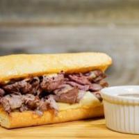 THE FRENCH DIP · ROAST BEEF THINLY SLICED, SWISS CHEESE, AU JUS, SERVED HOT