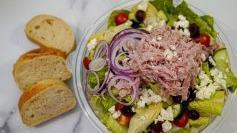Greek Salad · Chopped romaine, ham, cucumbers, tomatoes, artichoke hearts, kalamata olives, red onions, fe...