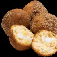 Birthday Cake Donut Holes · 4 count. Donut holes filled with colorful confetti and creamy vanilla frosting, dusted in ci...