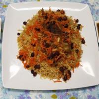 Qabuli Palow · Lamb shank, rice, raisins, carrots, almonds, onion.