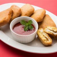 Paneer Pakoras (5 pcs) · Paneer slices dipped in mildly spiced batter and fried.