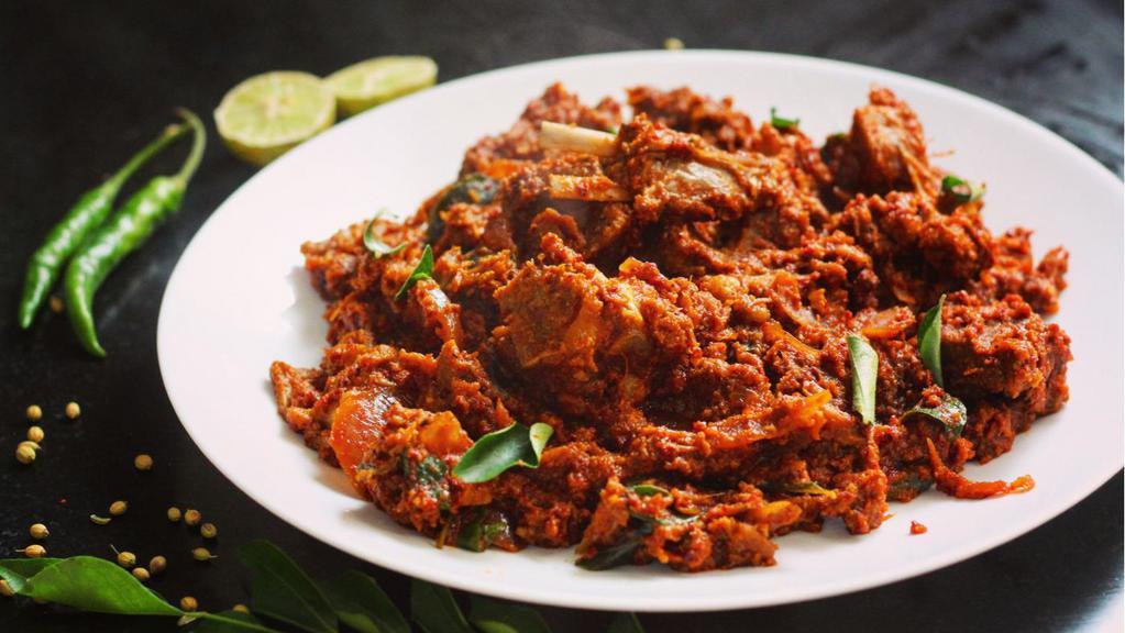 Mutton Sukka · Goat meat with bone cooked or pan fried with spices