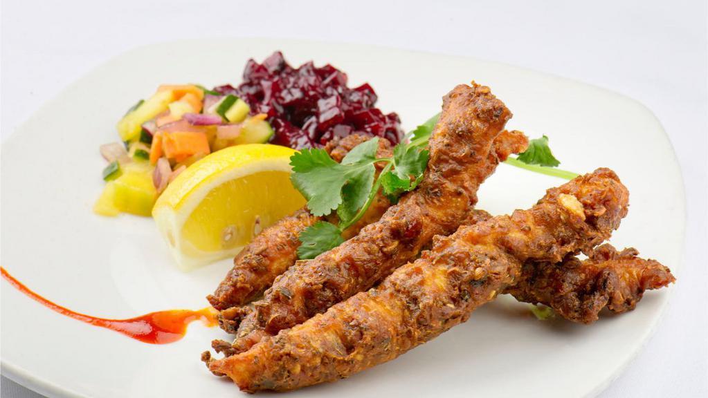 Fish Pakoras · Marinated fresh fish coated in chickpea batter and fried.