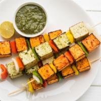 Tandoori Paneer Tikka · Homemade cheese marinated in yogurt with special herbs and spices.