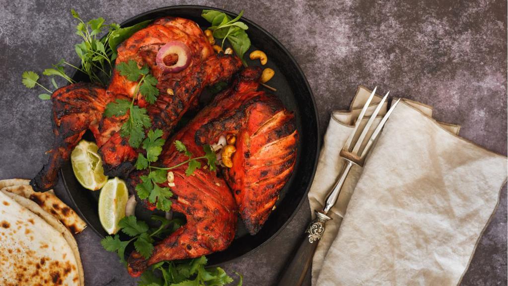 Whole Tandoori Chicken (4 pcs) · 2 legs and 2 breasts. Whole chicken marinated in yogurt with special herbs and spices.