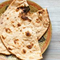 Tandoori Roti (2 pcs) · Whole wheat Indian bread baked in a clay oven.