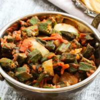 Bhindi Masala · Cut okra cooked with cubes of tomato and mild spices.