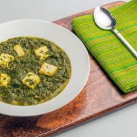 Saag Paneer · Indian cottage cheese cubes cooked with cream, spinach purée, herbs and spices.