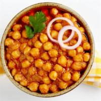 Chana Masala · Garbanzo beans (chickpeas) cooked with ginger, garlic and Indian spices.