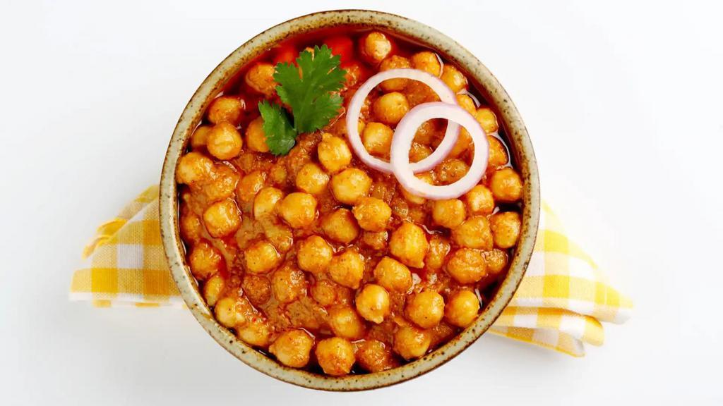(V) Channa Masala · Garbanzo beans cooked and flavoured with indian spices. Vegan.