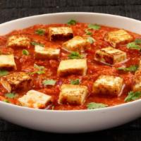 Paneer Butter Masala · Indian cottage cheese cubes cooked with creamy tomato and butter sauce.