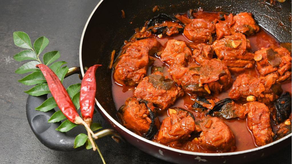 Garlic Chicken · Roasted garlic and chicken slowly cooked in spicy tomato sauce.