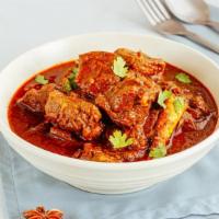 Lamb Vindaloo · Boneless lamb cooked with potatoes in a hot and spicy sauce.