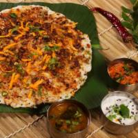 Andhra Spicy Uttapam · Puffy Indian pancake topped with onion, tomato and spicy Andhra chutney.