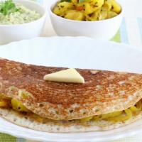 Butter Masala Dosa · Thin crispy crepe spread with butter and filled with potato curry.