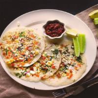 Paneer Uttapam · Puffy Indian pancake topped with homemade Indian cottage cheese.
