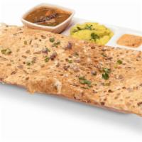 Onion Rava Masala Dosa · Thin and crispy flavored Indian crepe made with wheat cream and rice flour, filled with onio...