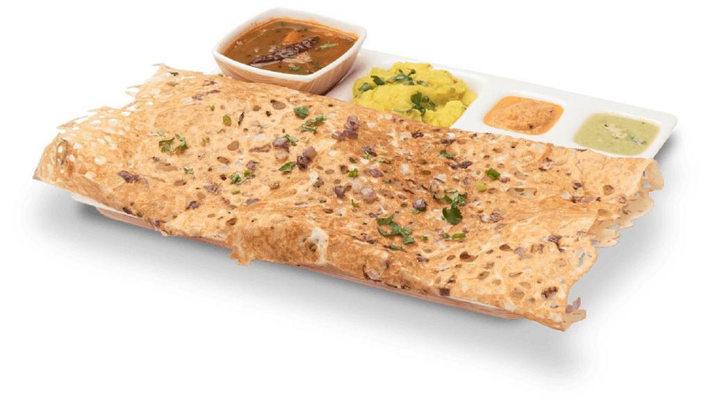 Onion Rava Masala Dosa · Thin and crispy flavored Indian crepe made with wheat cream and rice flour, filled with onion and potato curry.