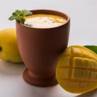 Mango Lassi · Homemade yogurt flavored with mango, a delightful drink.
