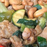 65. Cashew Chicken · Served with steamed rice and fried won ton.
