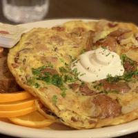 German Omelet · Omelet with potatoes, onions, bacon, sour cream. All omelets come with a side of German brea...