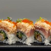 Titanic · Shrimp tempura, cucumber topped with salmon, tuna, spicy crab meat and tobiko.