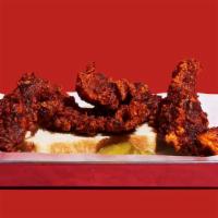 Nashville Hot Chicken Tender Combo · Four crispy breaded, spicy hot chicken tenders. Served with spicy mayo and choice of side.