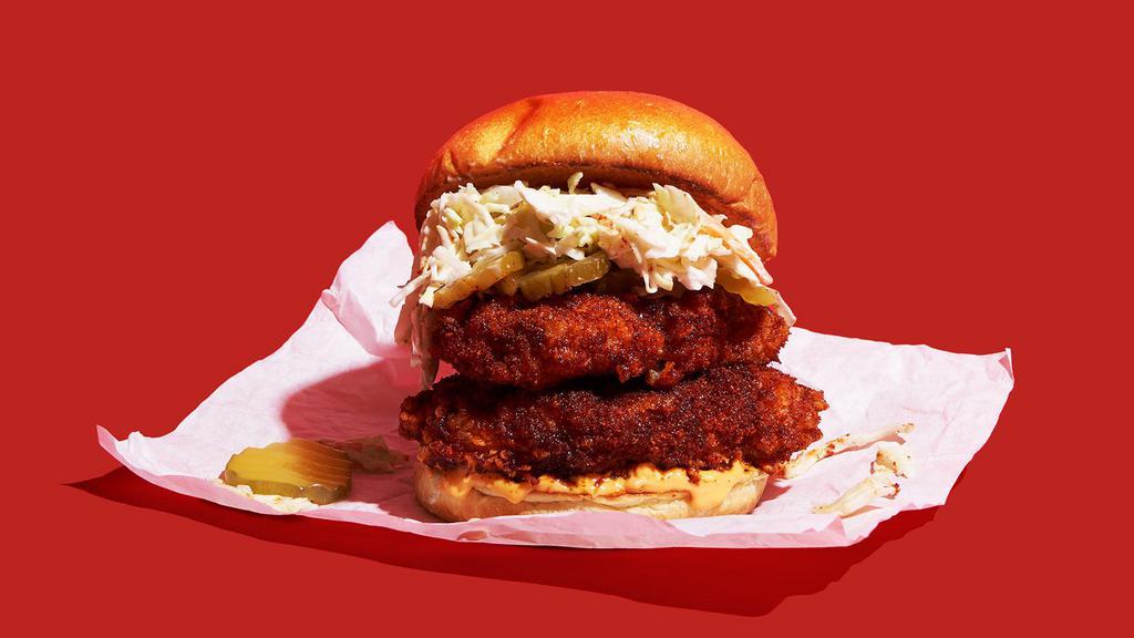 Double Stack Nashville Hot Fried Chicken Sandwich Combo · Two Nashville-style spicy hot, crispy fried chicken breasts with coleslaw, pickles, and spicy mayo on a brioche bun. Served with your choice of side and a drink.