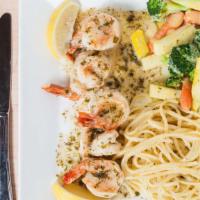 Jumbo Prawn Scampi · Sautéed in white wine, butter and garlic, served with vegetables and linguine tossed in a sc...
