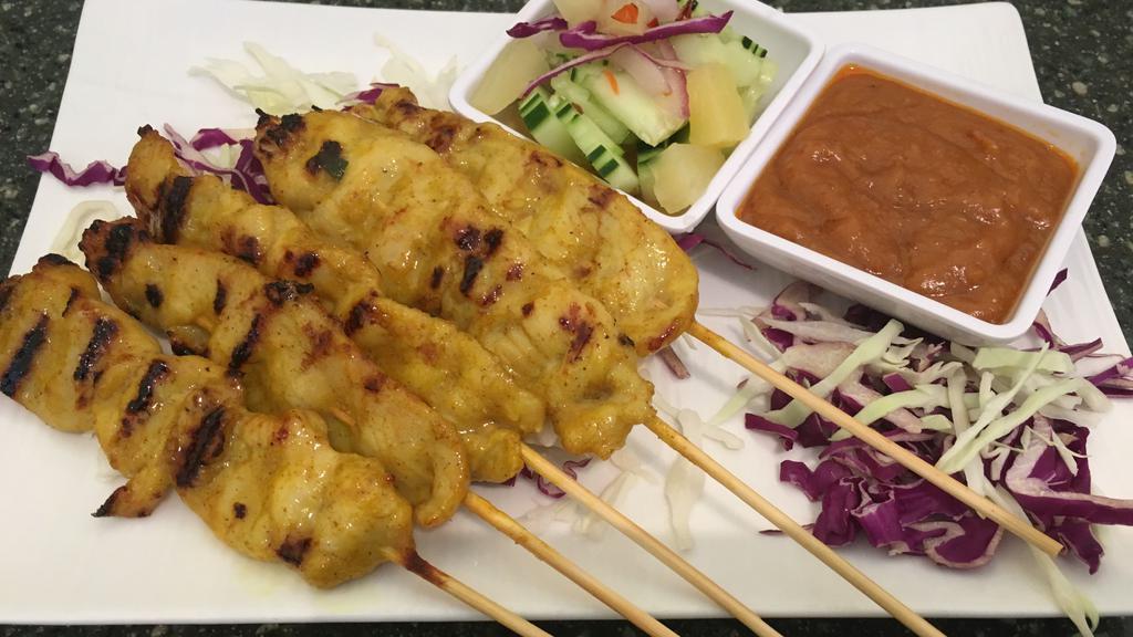 Satay Chicken · Famous grilled chicken skewers with thai peanut sauce and cucumber salad.